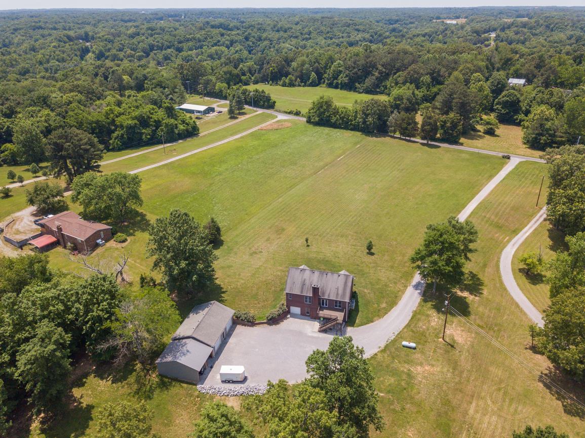 3707 Edd Ross Road Cedar Hill, TN 37032 - Photo 7 of 30 an aerial view of a house with a garden and swimming pool