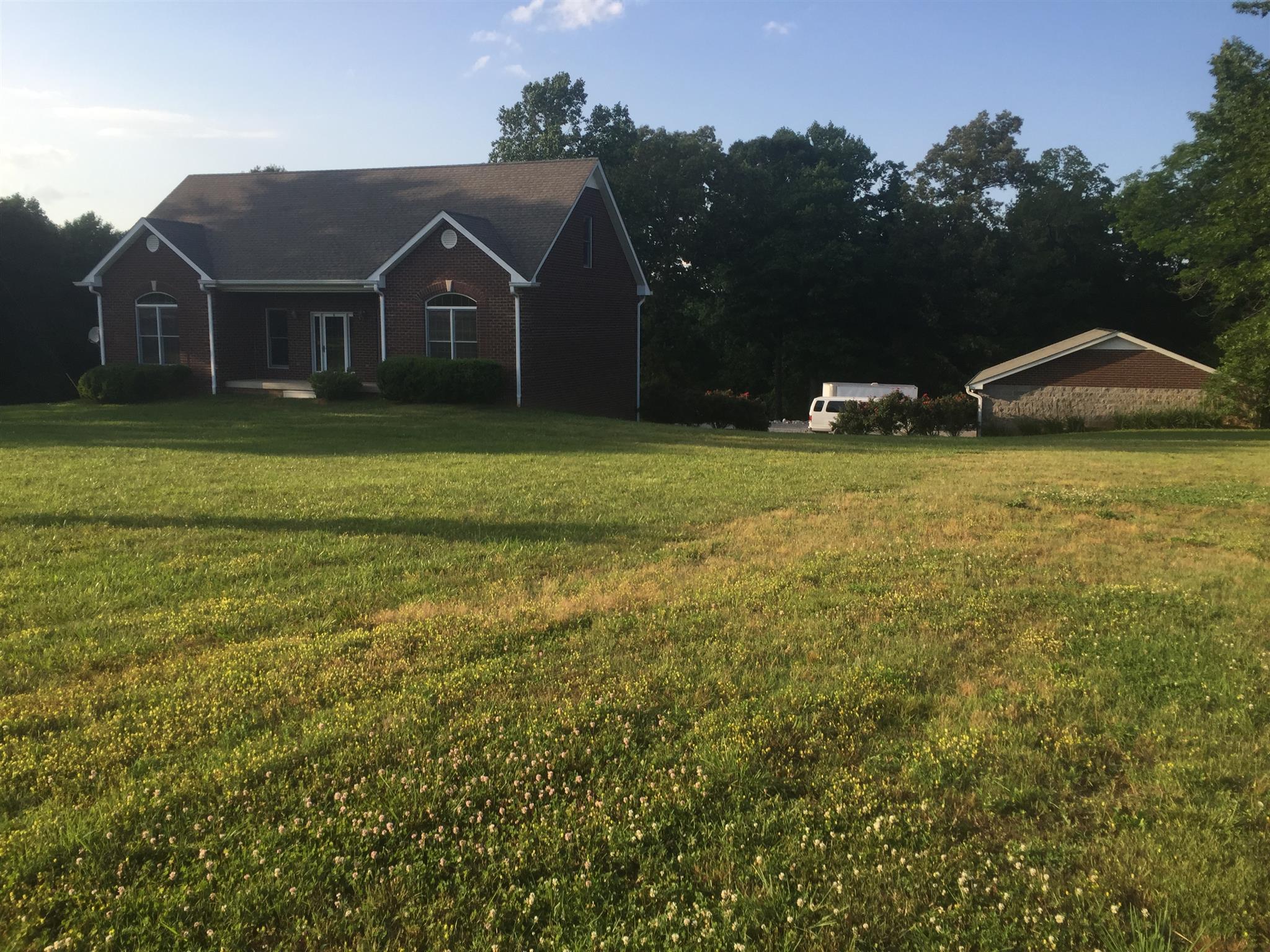 3707 Edd Ross Road Cedar Hill, TN 37032 - Photo 10 of 30 a front view of a house with garden