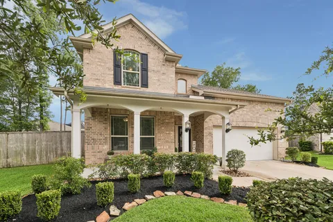 front view of a house with a garden