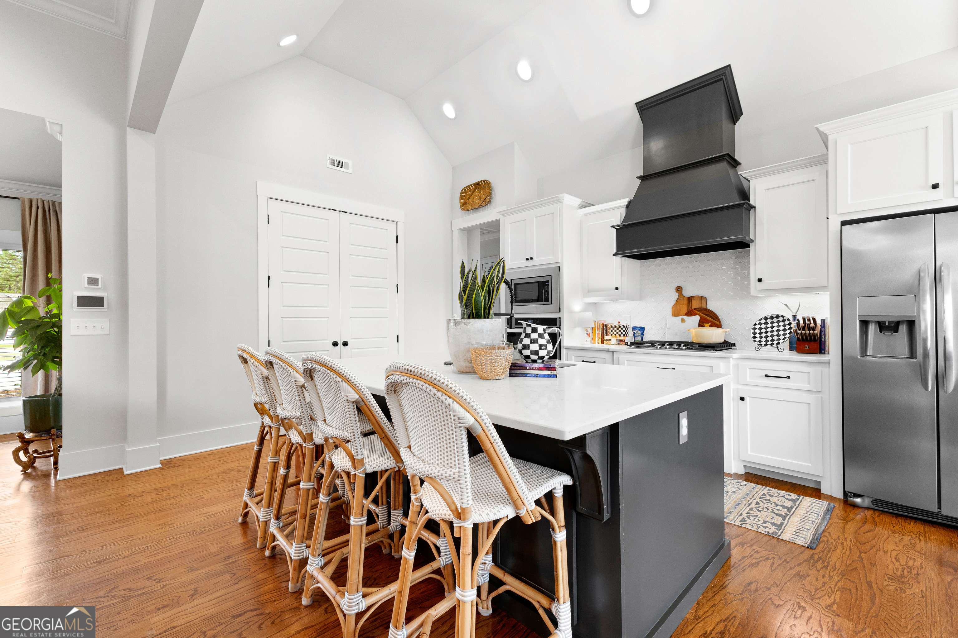 21 Waterview Circle Newnan, GA 30263 - Photo 18 of 75 a kitchen with a sink a refrigerator and chairs