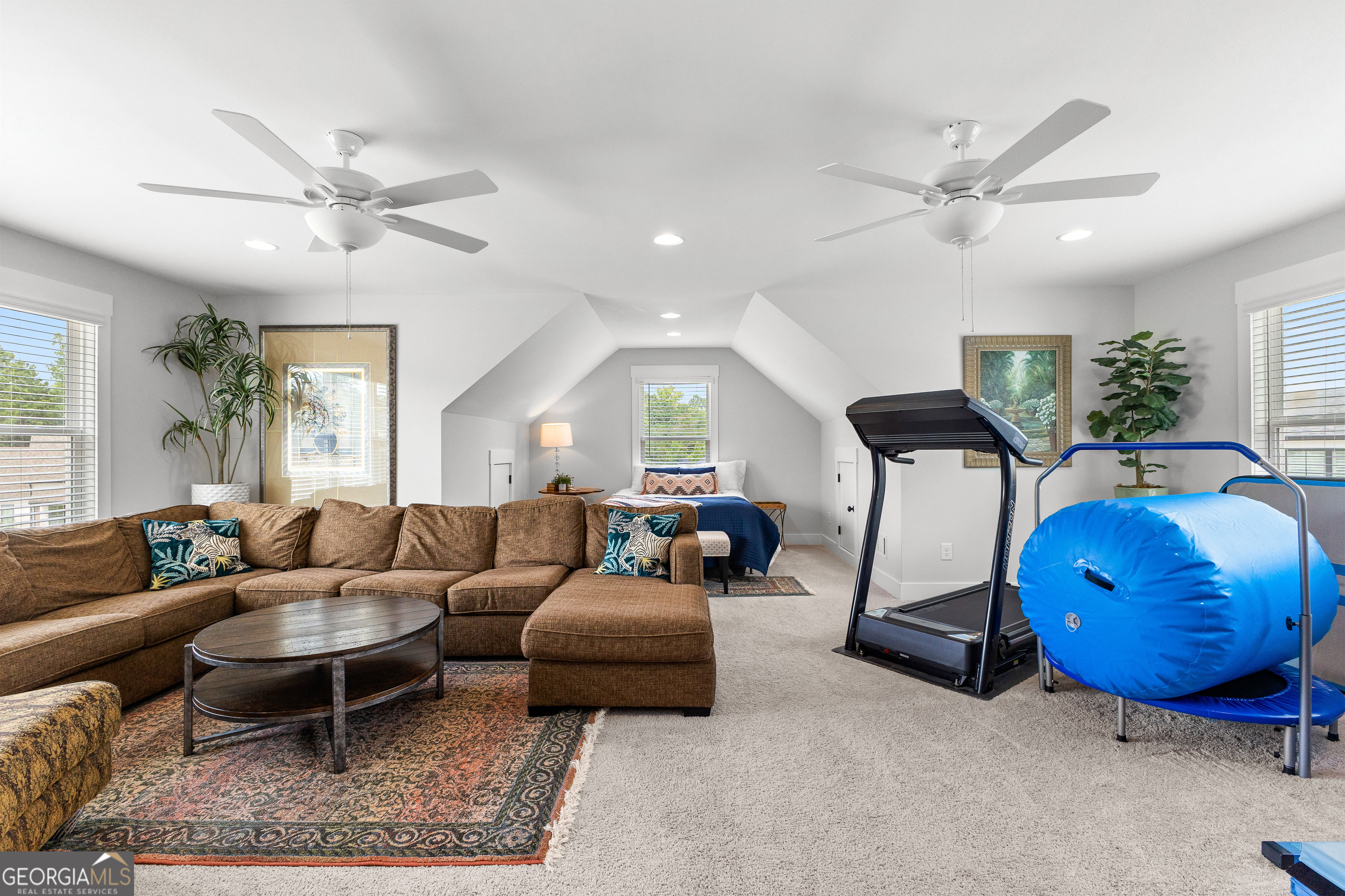 21 Waterview Circle Newnan, GA 30263 - Photo 55 of 75 a living room with furniture a ceiling fan and a rug
