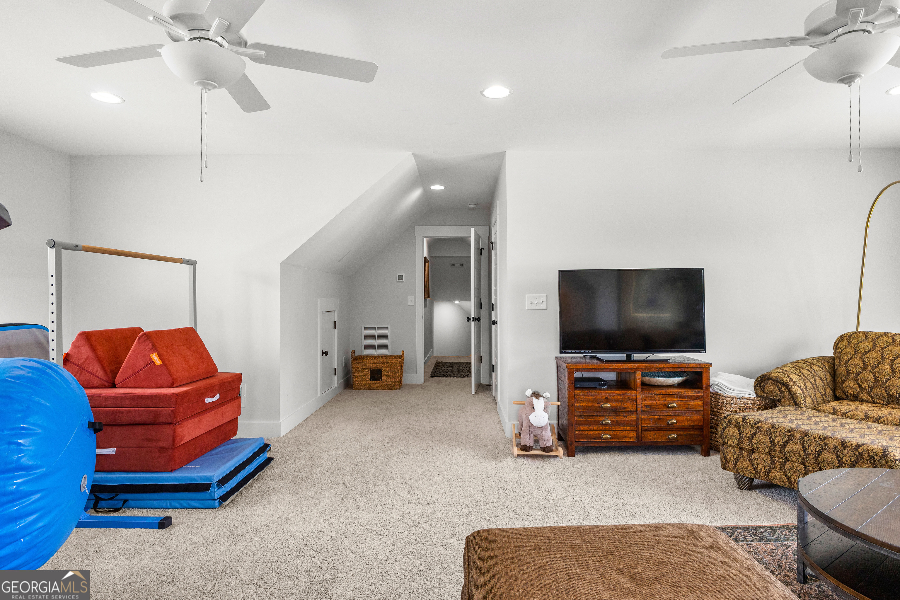21 Waterview Circle Newnan, GA 30263 - Photo 57 of 75 a living room with furniture and a flat screen tv