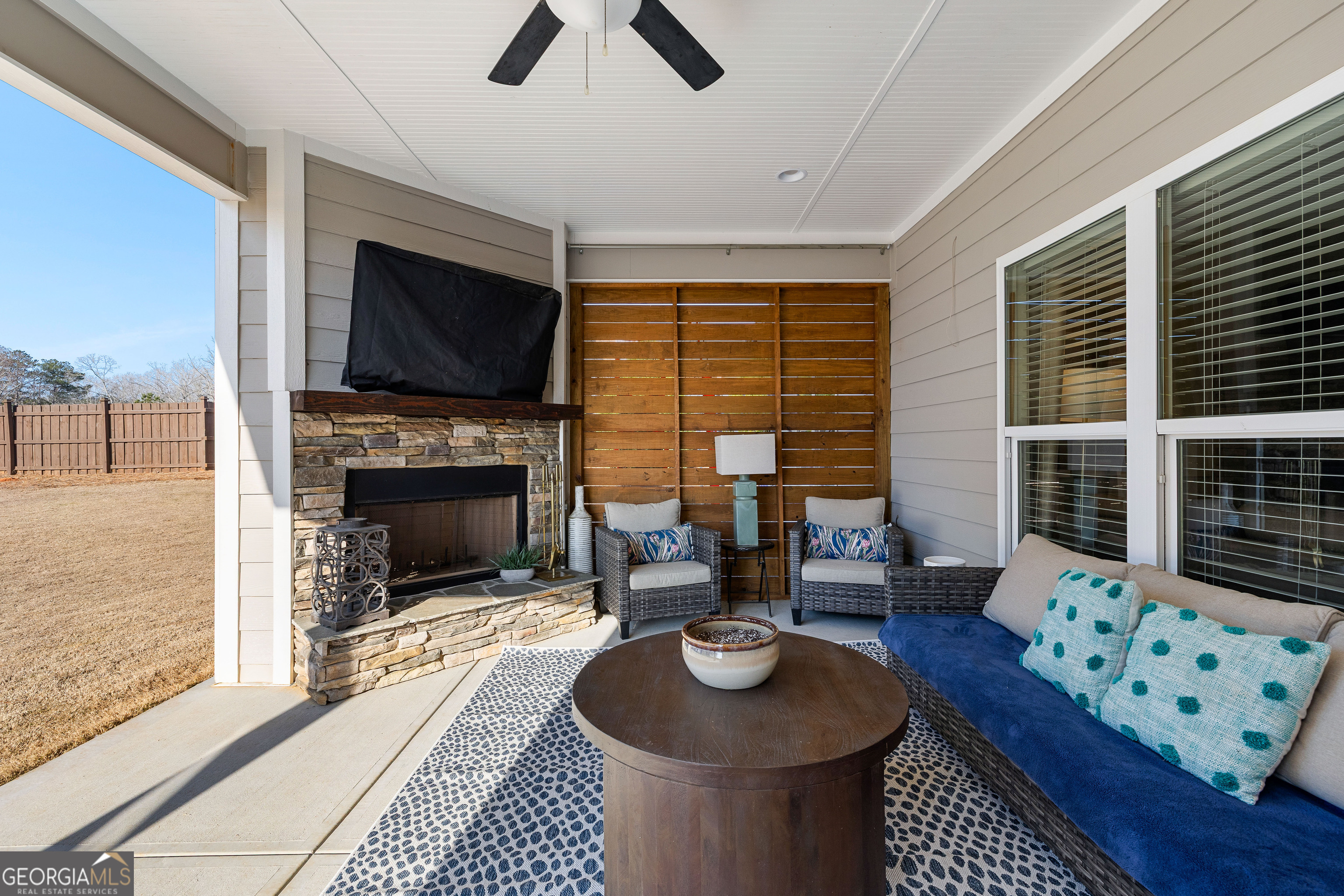 21 Waterview Circle Newnan, GA 30263 - Photo 62 of 75 a living room with furniture a fireplace and a flat screen tv