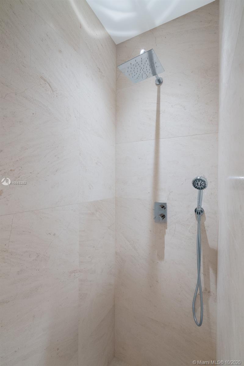 360 Ocean Drive, Unit PH1S Key Biscayne, FL 33149 - Photo 11 of 30 a bathroom with a shower
