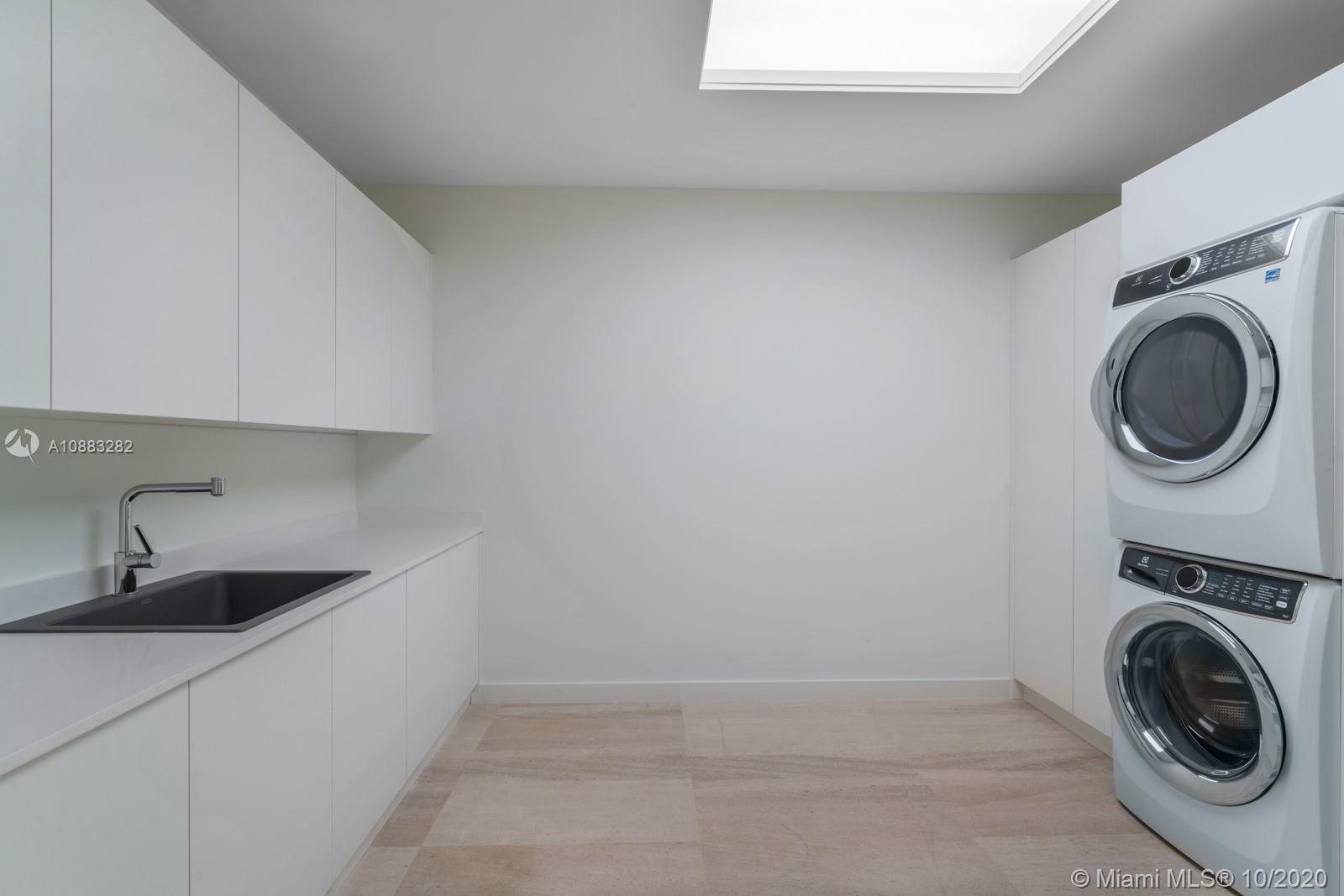 360 Ocean Drive, Unit PH1S Key Biscayne, FL 33149 - Photo 12 of 30 a utility room with sink dryer and washer