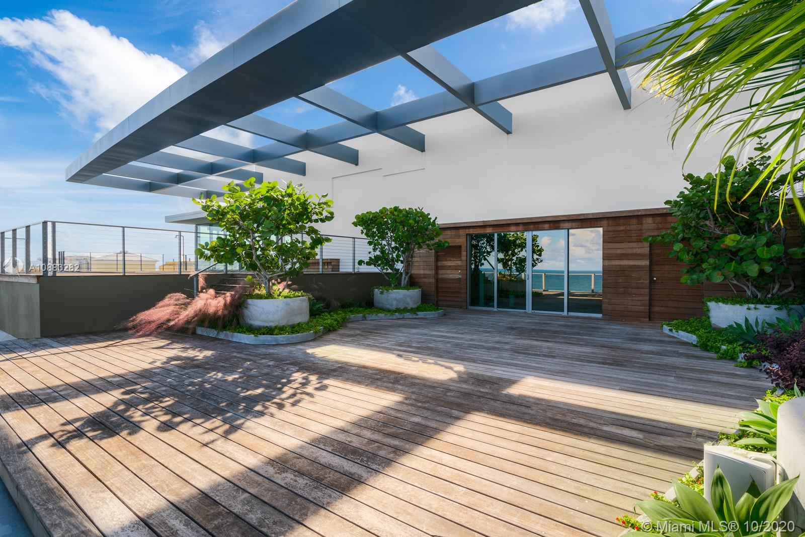 360 Ocean Drive, Unit PH1S Key Biscayne, FL 33149 - Photo 16 of 30 a view of a backyard with plants and plants