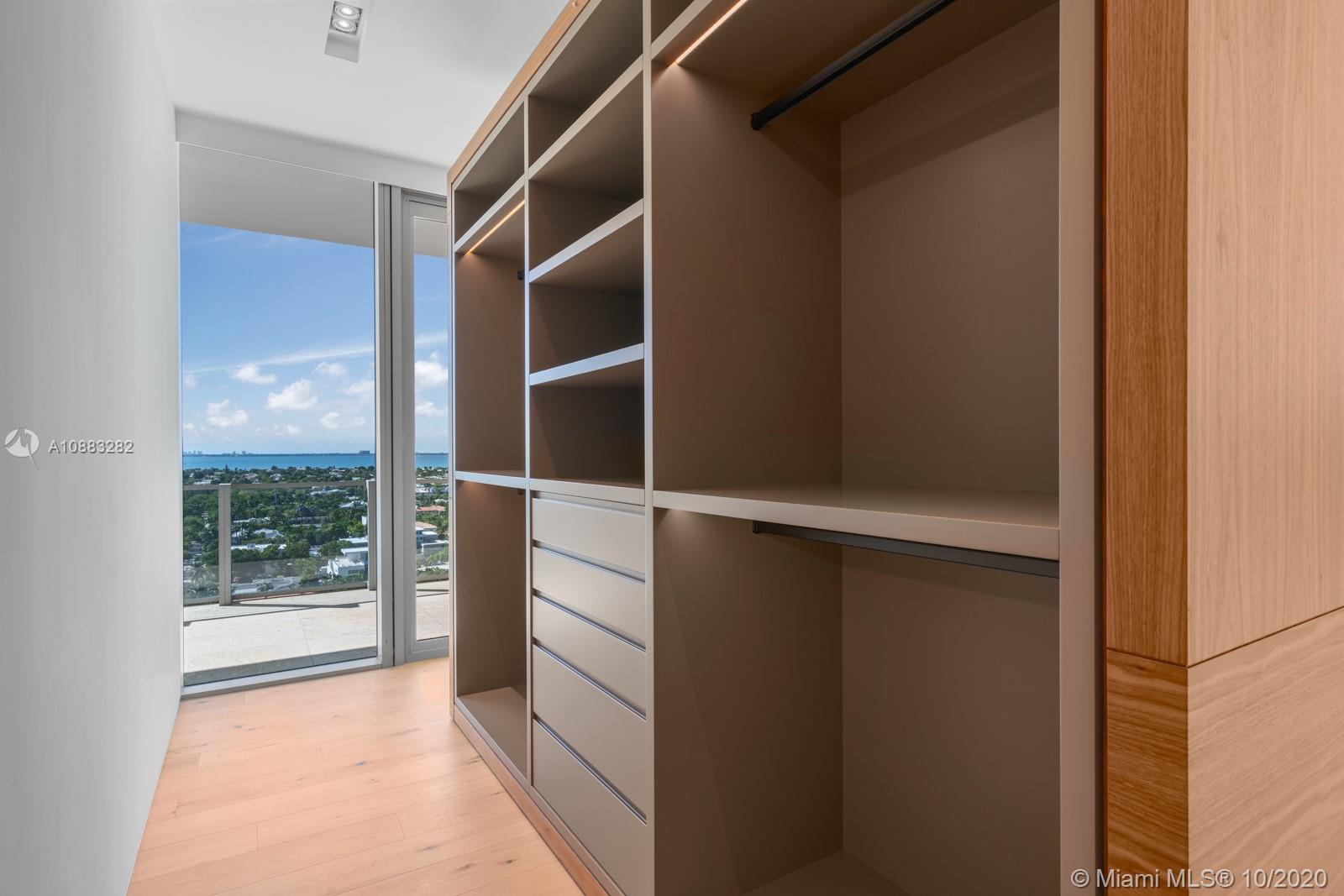 360 Ocean Drive, Unit PH1S Key Biscayne, FL 33149 - Photo 7 of 30 a view of walk in closet with empty racks
