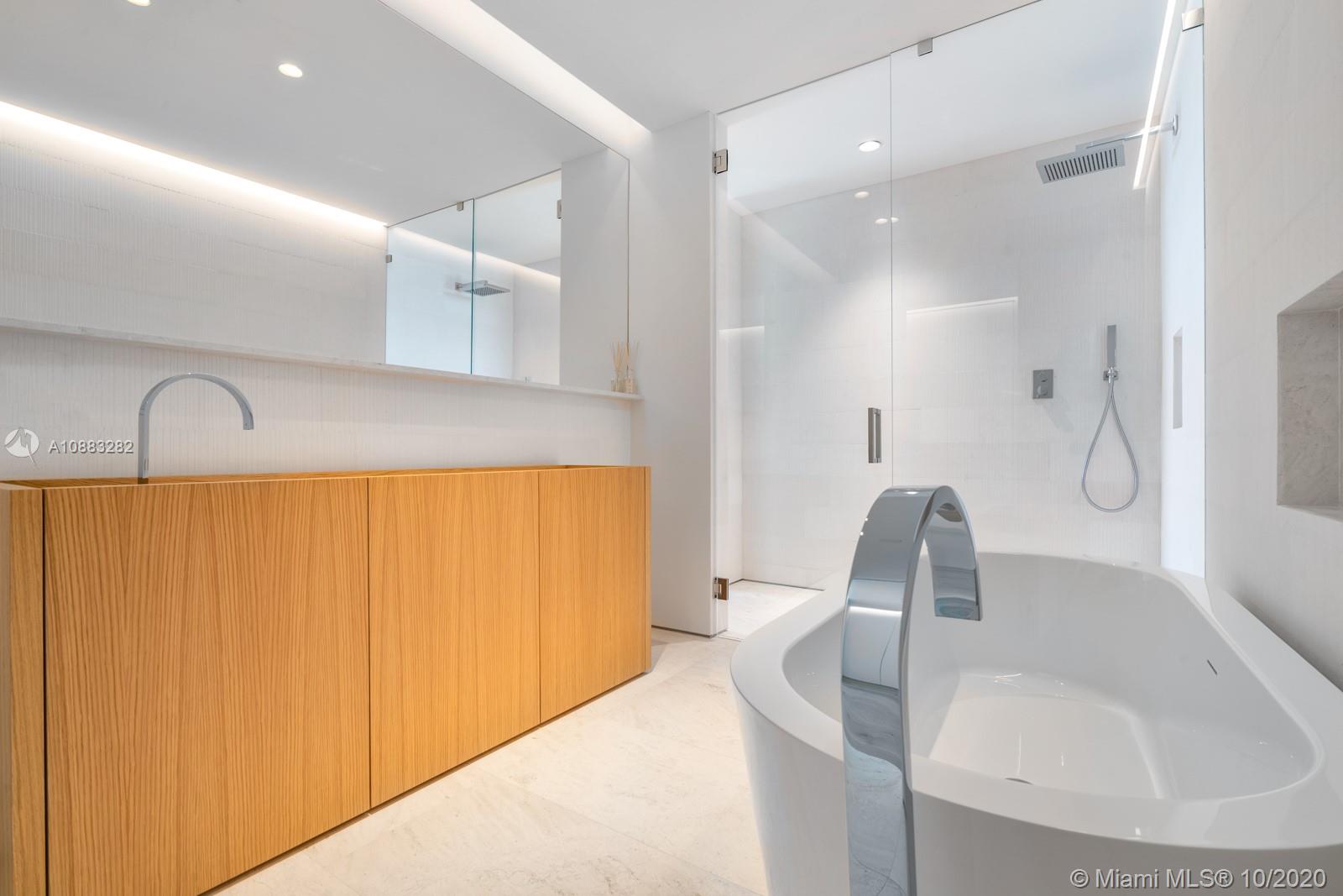 360 Ocean Drive, Unit PH1S Key Biscayne, FL 33149 - Photo 8 of 30 a bathroom with a sink and a mirror