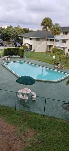 a view of a lake in middle of a town