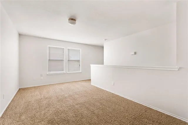 a view of a kitchen with cabinet and a chandelier fan