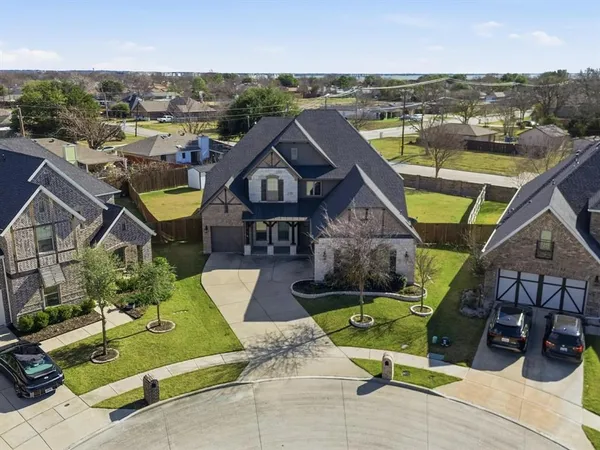 an aerial view of a house with swimming pool and ocean view