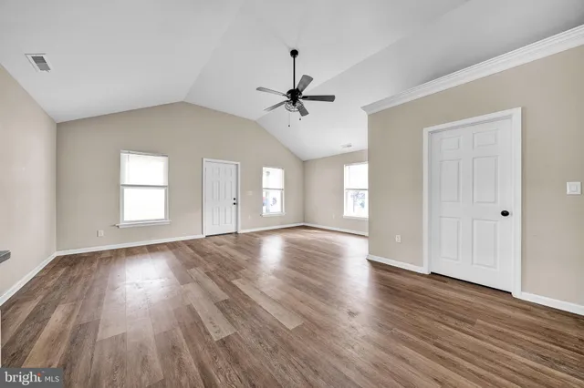 an empty room with window and windows