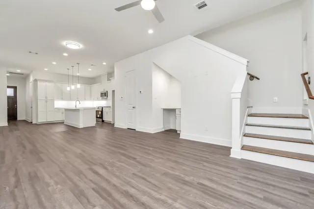 a view of kitchen with furniture and wooden floor
