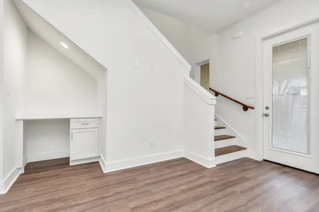 a view of entryway with wooden floor