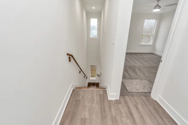 a view of a hallway view with staircase