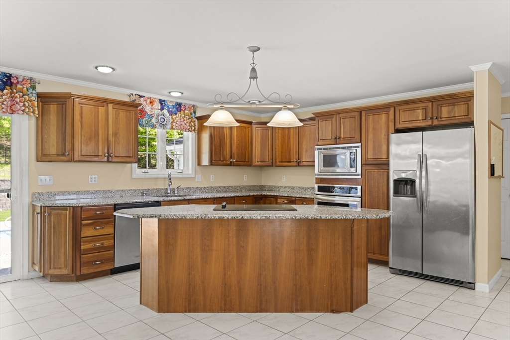 1507 East Mountain Road Westfield, MA 01085 - Photo 4 of 42 a kitchen with stainless steel appliances granite countertop a refrigerator a sink dishwasher a stove with wooden cabinets and floor
