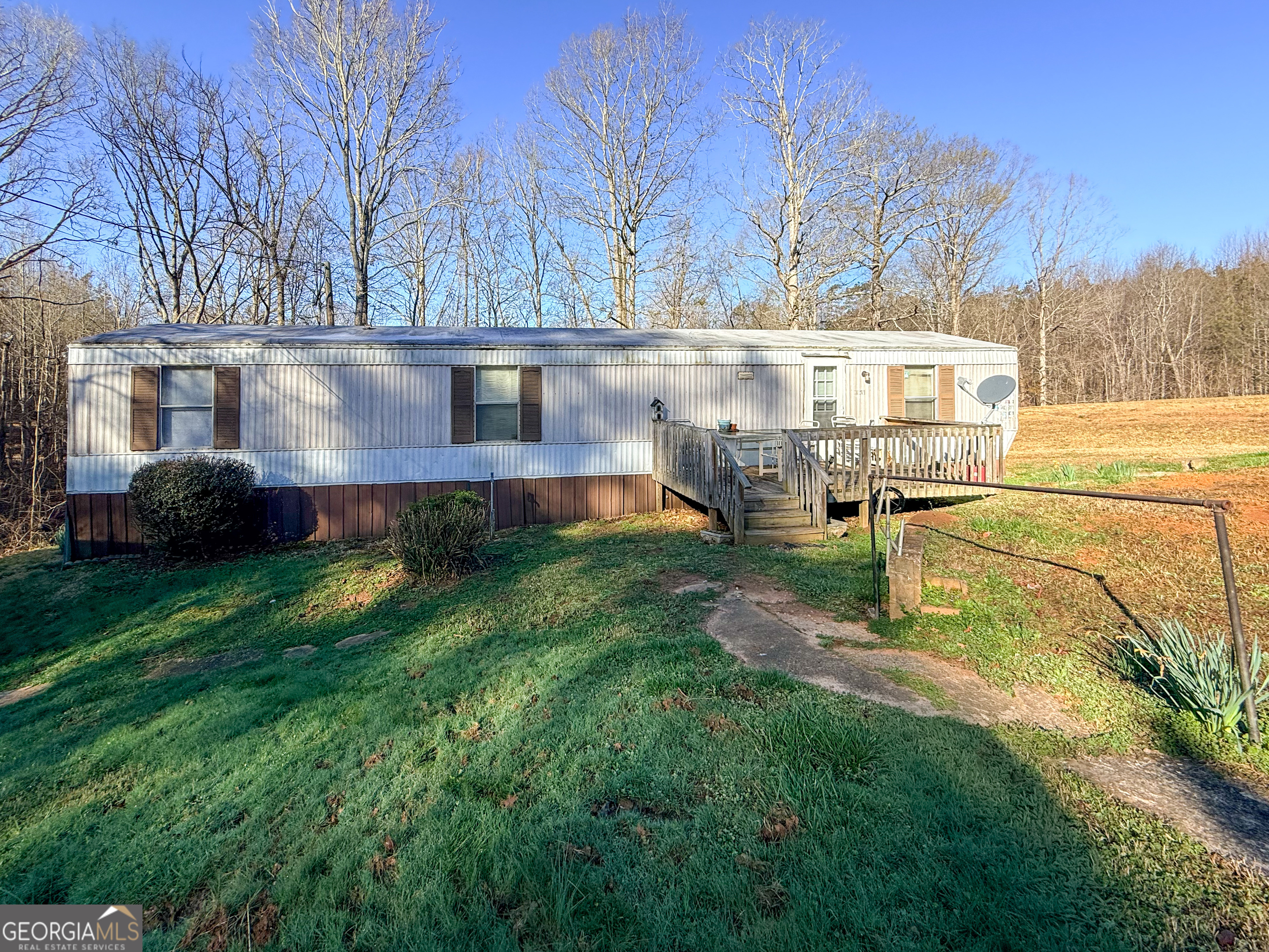 1177 Twin River Orchard Road Demorest, GA 30535 - Photo 21 of 27 a front view of a house with garden