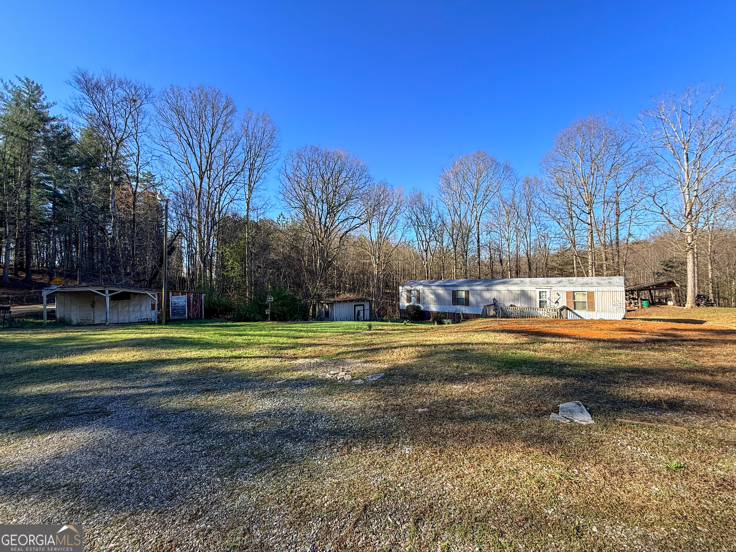 1177 Twin River Orchard Road Demorest, GA 30535 - Photo 22 of 27 a swimming pool view with large trees and grass