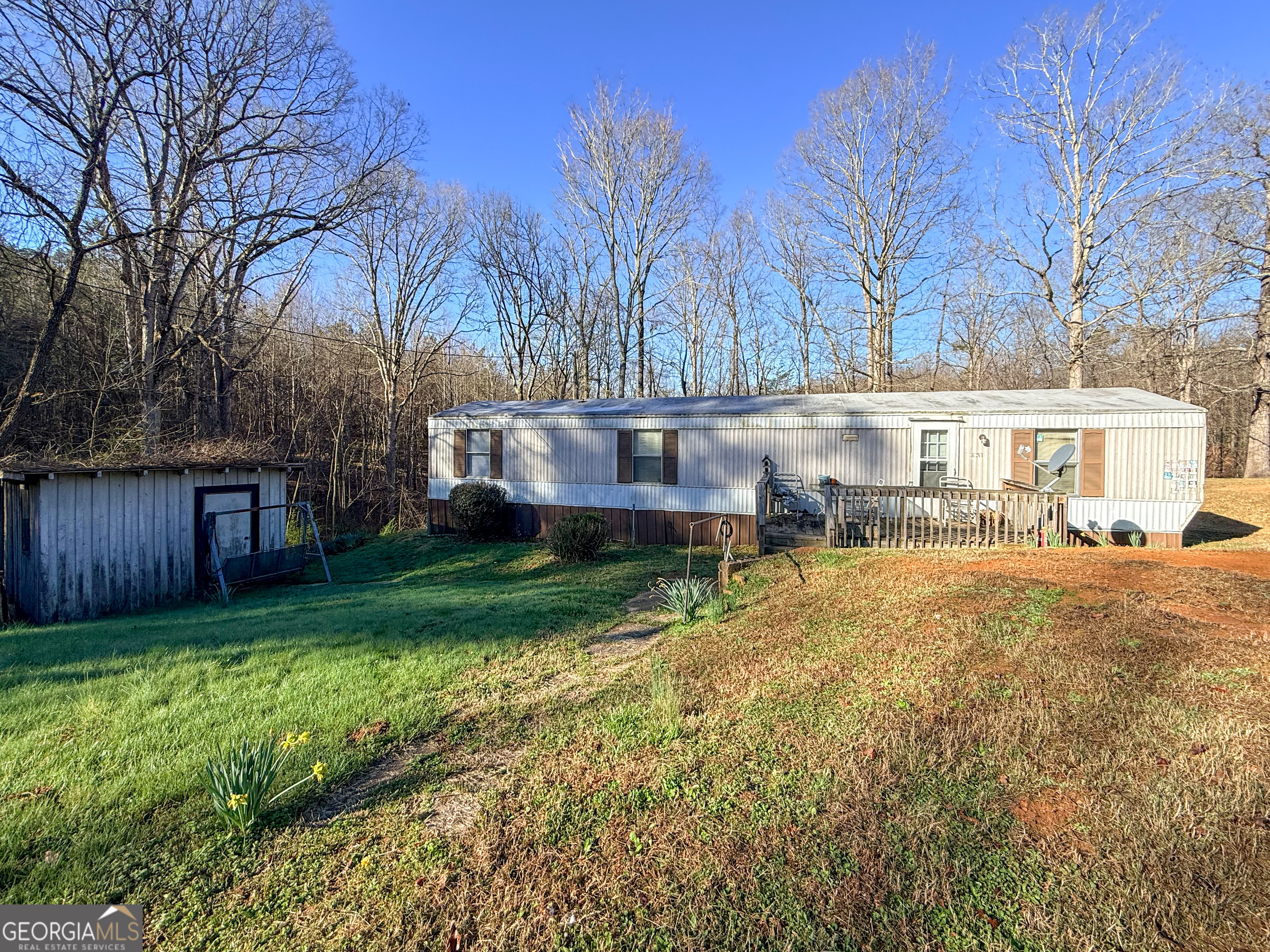 1177 Twin River Orchard Road Demorest, GA 30535 - Photo 24 of 27 a view of a house with a yard and sitting area