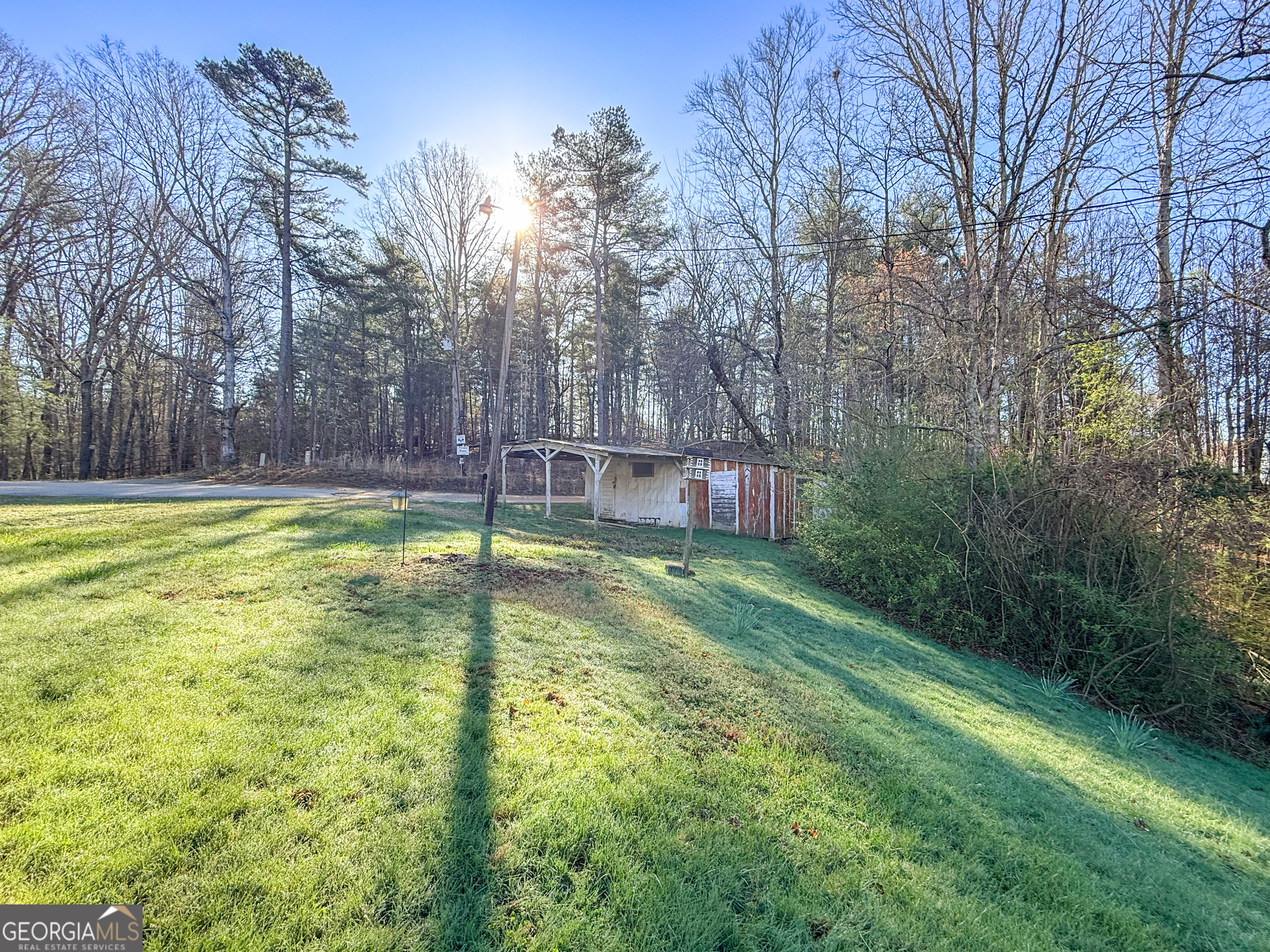 1177 Twin River Orchard Road Demorest, GA 30535 - Photo 26 of 27 a view of a swimming pool with a yard