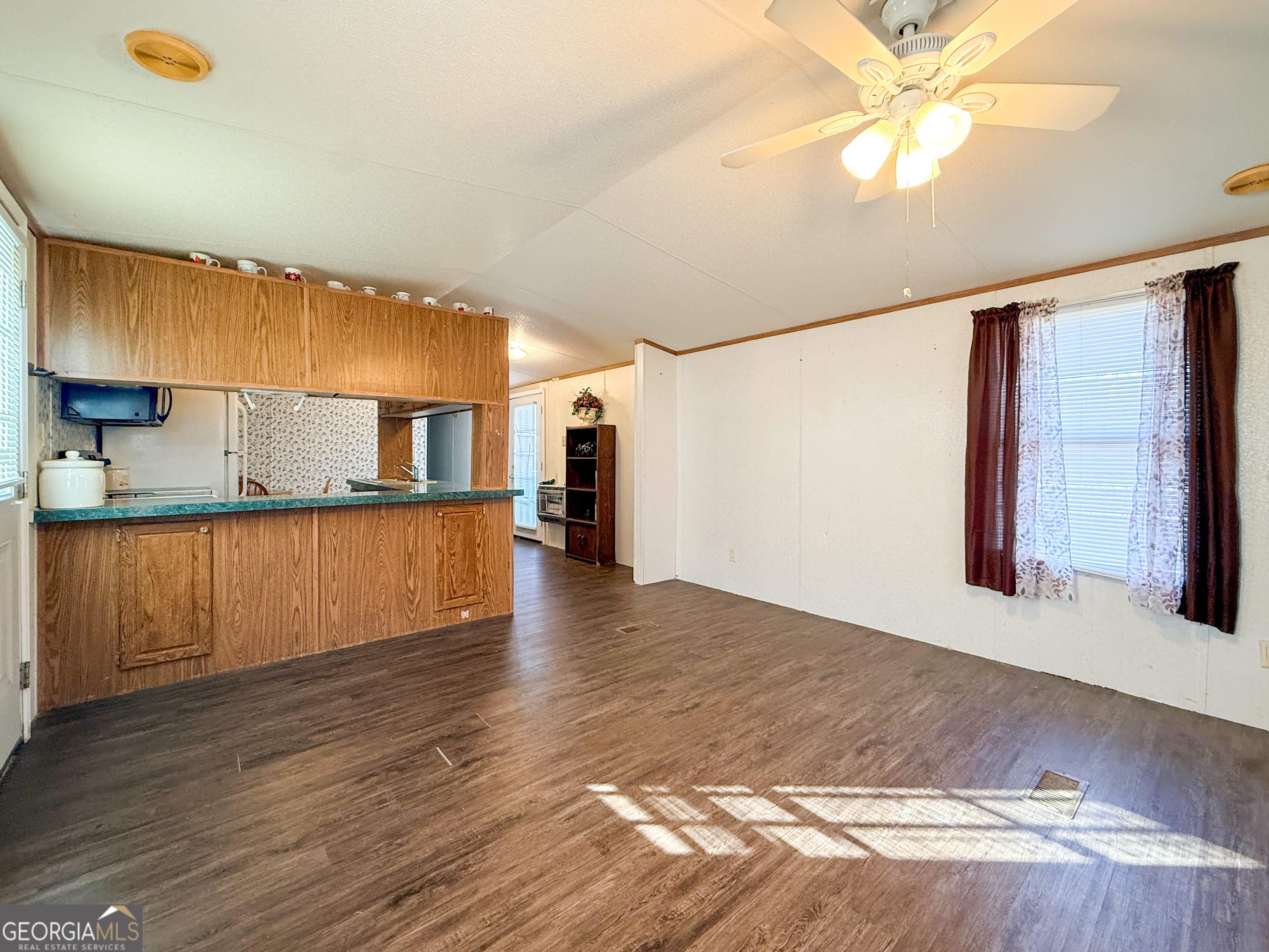 1177 Twin River Orchard Road Demorest, GA 30535 - Photo 3 of 27 a view of kitchen with wooden floor and window