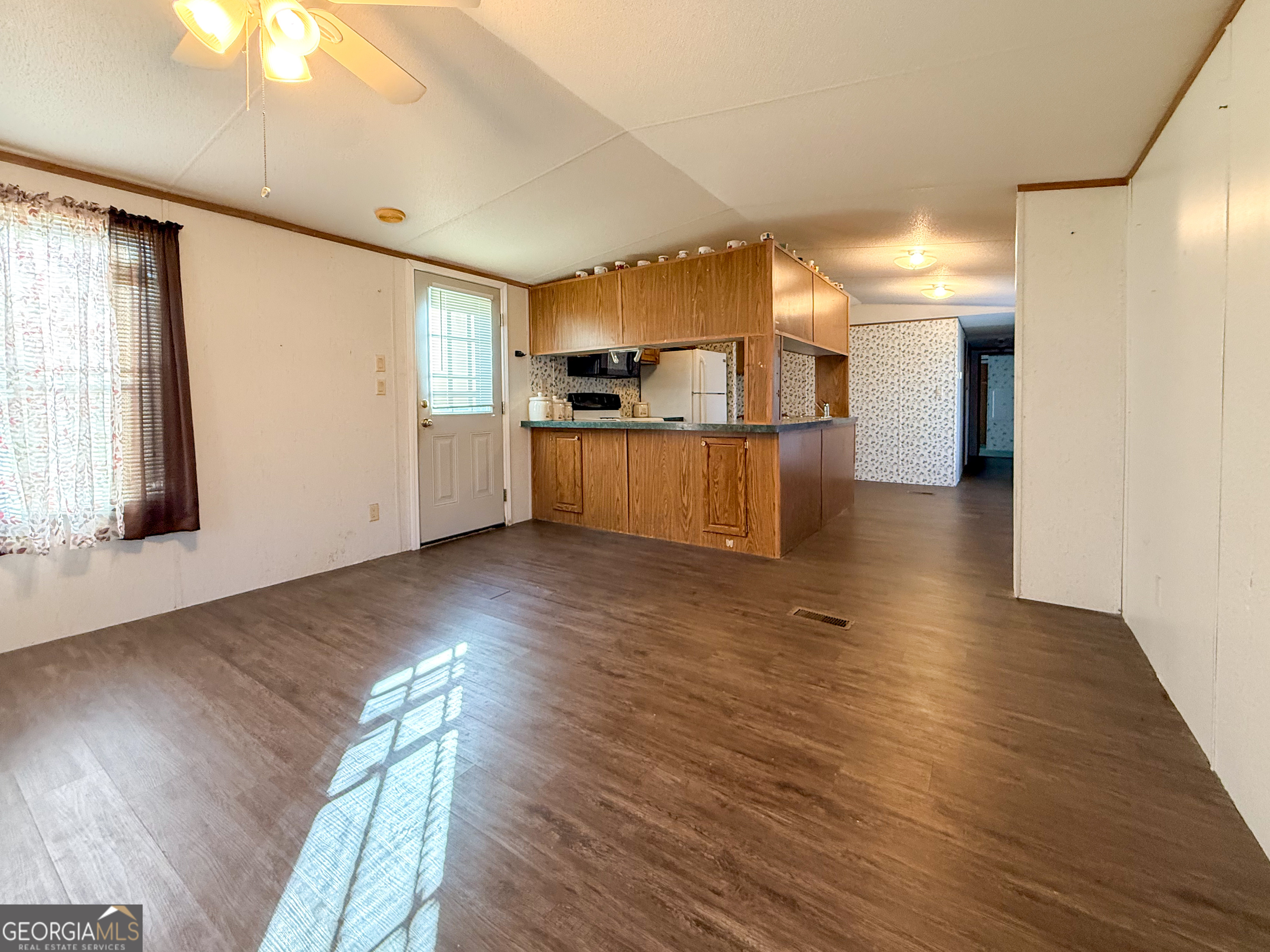 1177 Twin River Orchard Road Demorest, GA 30535 - Photo 4 of 27 a view of a kitchen with a sink and a refrigerator