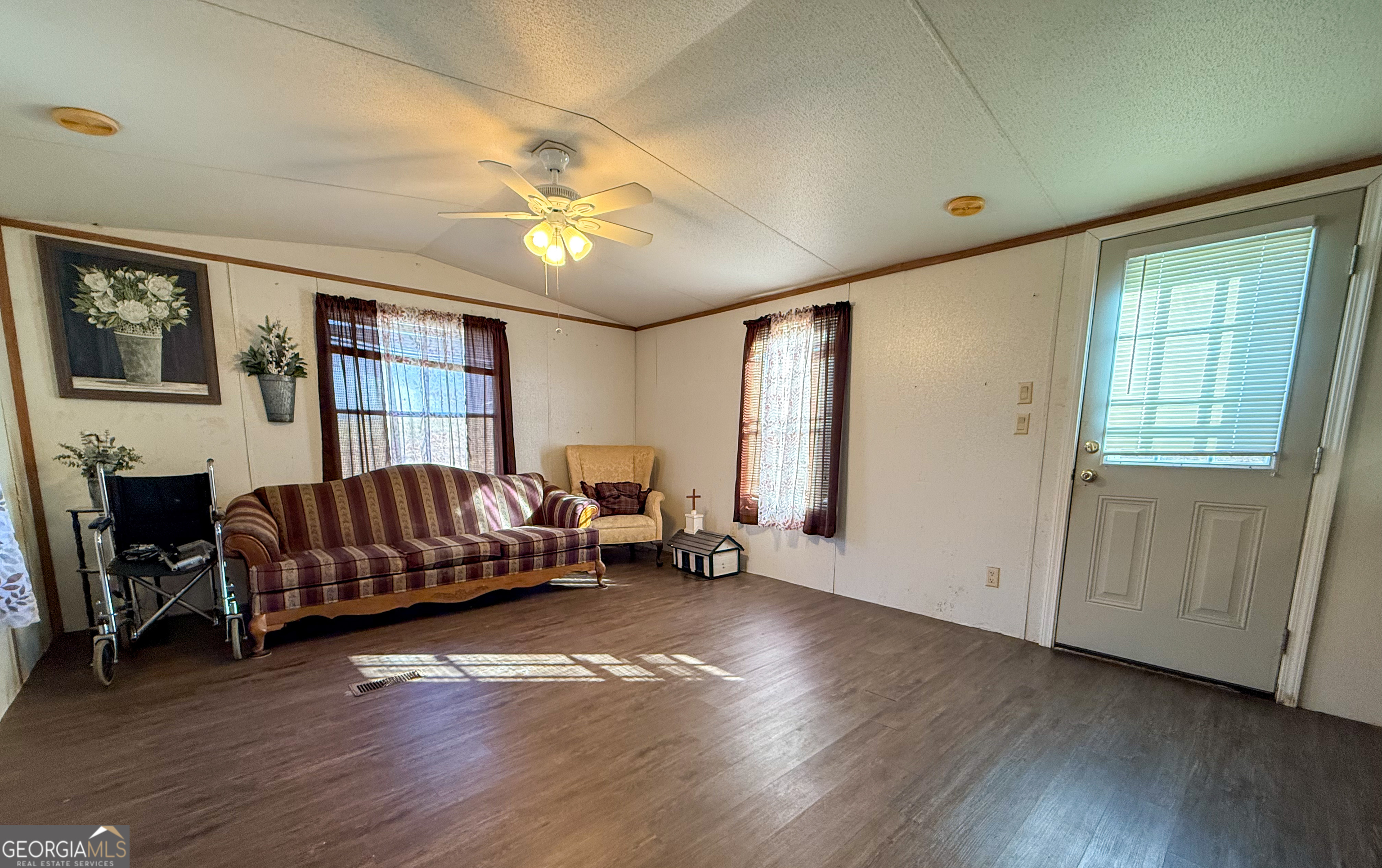 1177 Twin River Orchard Road Demorest, GA 30535 - Photo 5 of 27 a living room with furniture and a flat screen tv