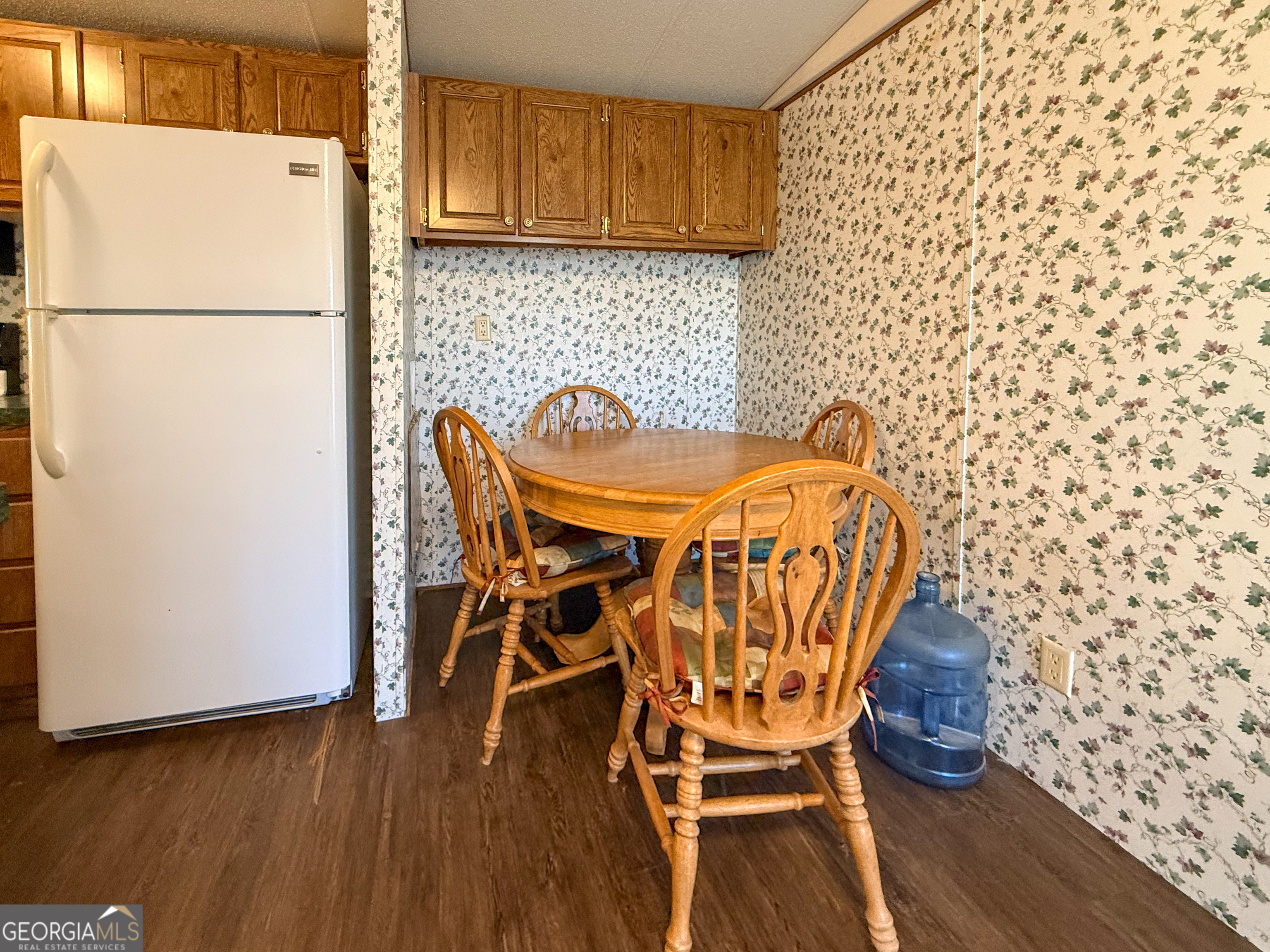 1177 Twin River Orchard Road Demorest, GA 30535 - Photo 7 of 27 a white refrigerator freezer sitting inside of a kitchen