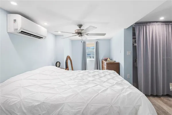 a large white bed in a white room