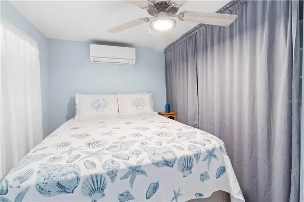 a large white bed in a small room