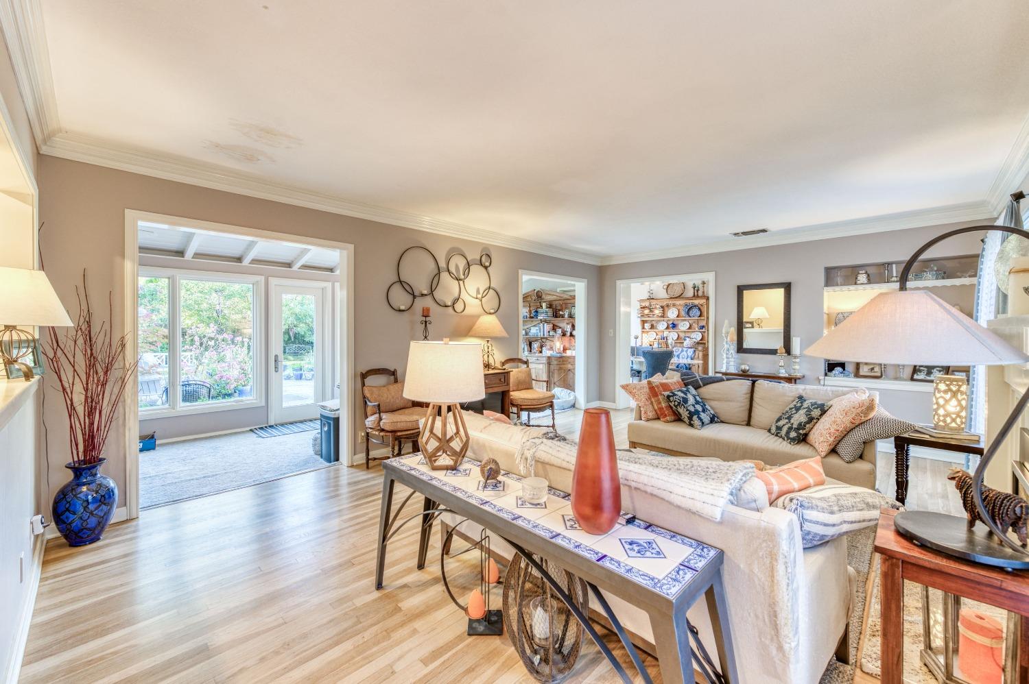 323 East Hampton Way Fresno, CA 93704 - Photo 5 of 44 a living room with furniture and a wooden floor