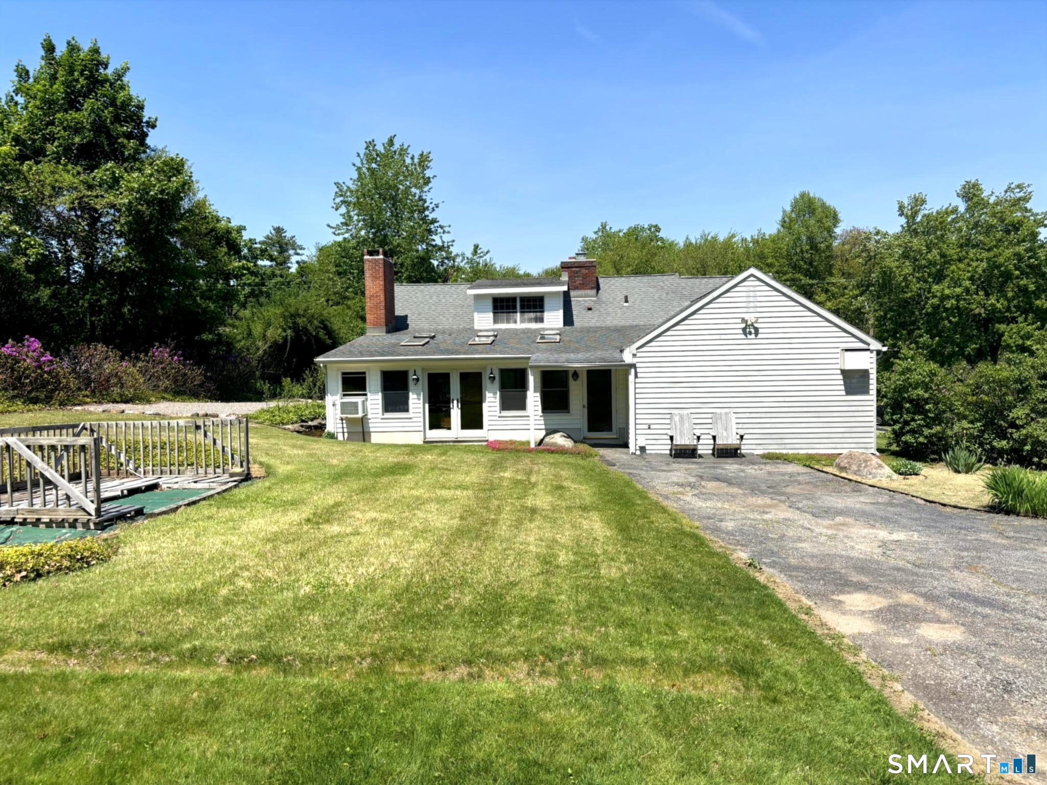 44 Summit Road Prospect, CT 06712 - Photo 3 of 40 a front view of house with yard outdoor seating and green space