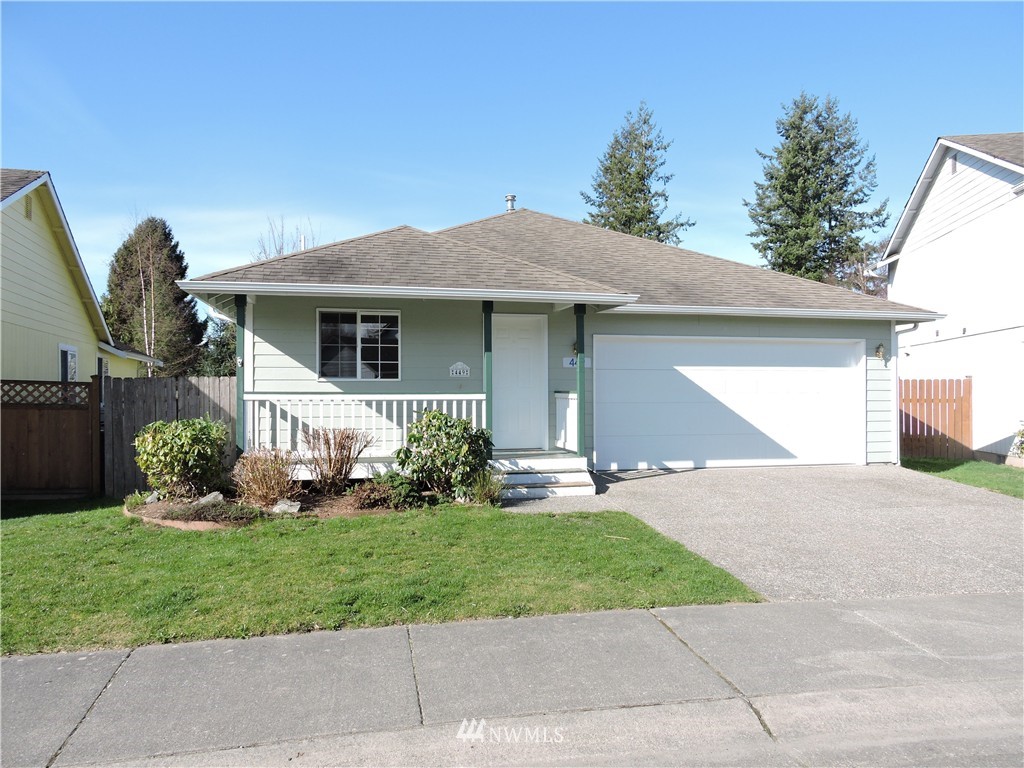 449 Spring Lane Sedro-Woolley, WA 98284 - Photo 1 of 11 a front view of a house with a yard and potted plants