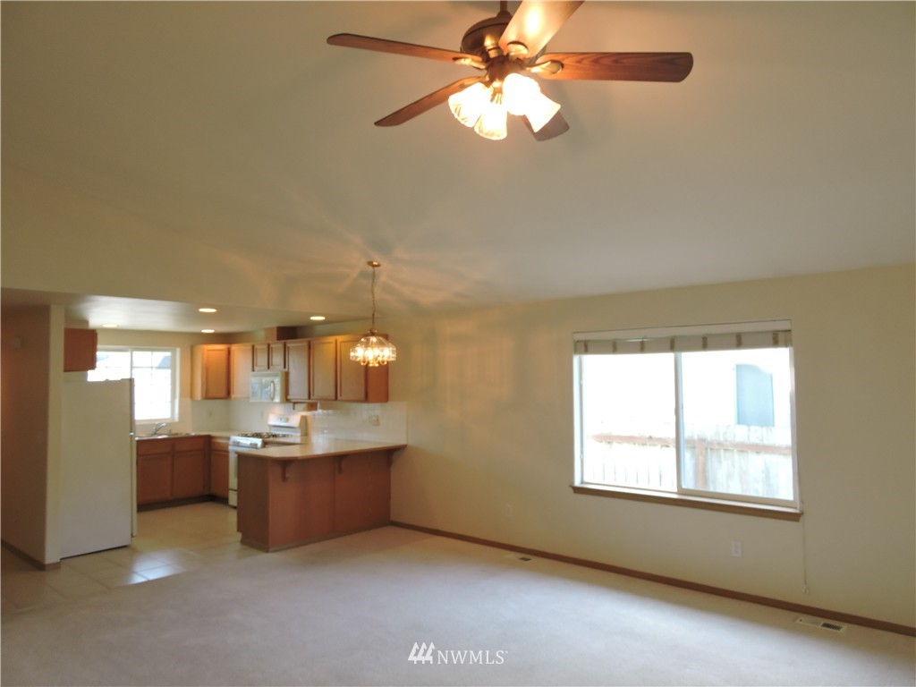 449 Spring Lane Sedro-Woolley, WA 98284 - Photo 3 of 11 a view of a kitchen with a sink hardwood floor and a window