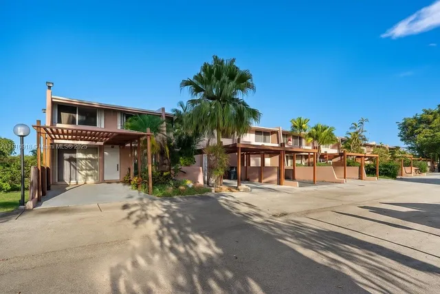 a view of a chairs and table in the patio