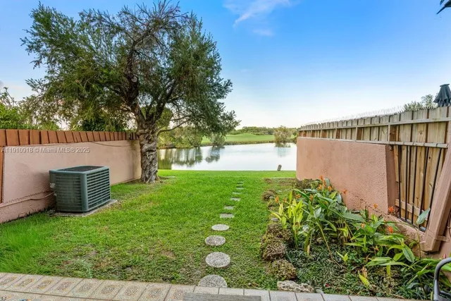 a view of a backyard with plants
