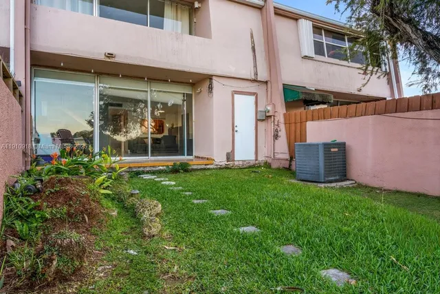 front view of a building with a yard