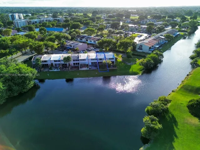 an aerial view of a house with a lake view