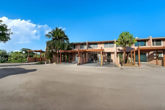 a view of a street with a building in the background