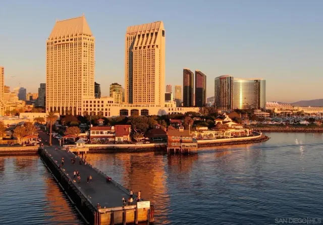 a view of a ocean with tall buildings