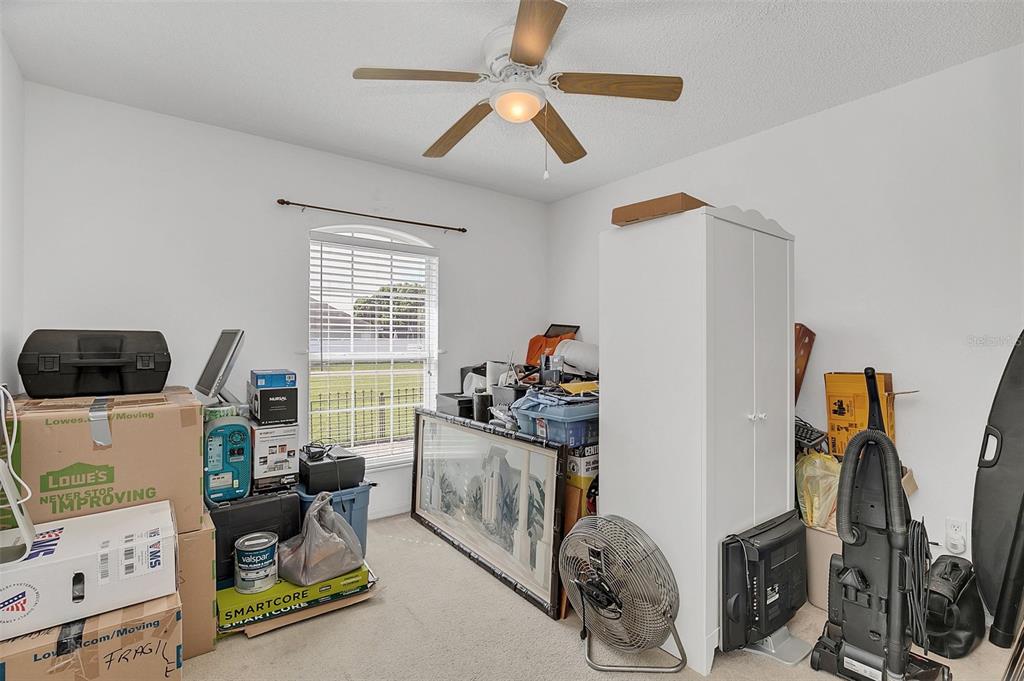 1727 Concert Road Deltona, FL 32738 - Photo 21 of 29 BEDROOM 2 TOWARD FRONT OF HOUSE