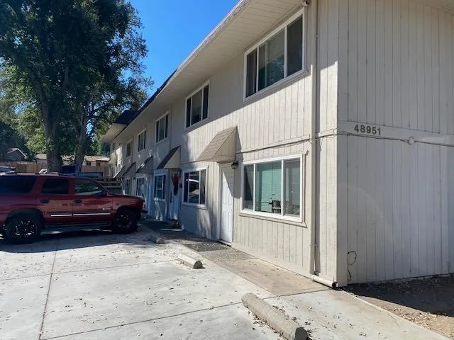 a view of a car park in front of house