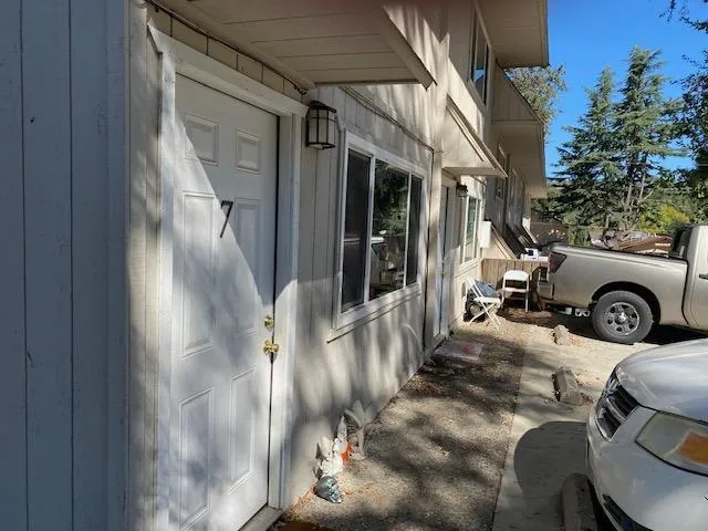 a view of living room filled with furniture and a garage