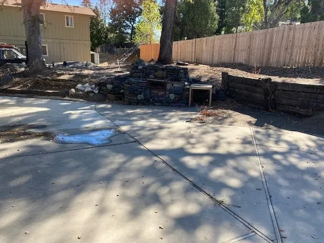a view of a backyard with a sitting area