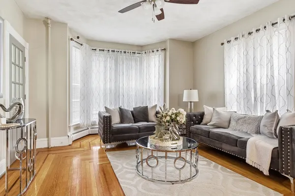 a living room with furniture and a large window