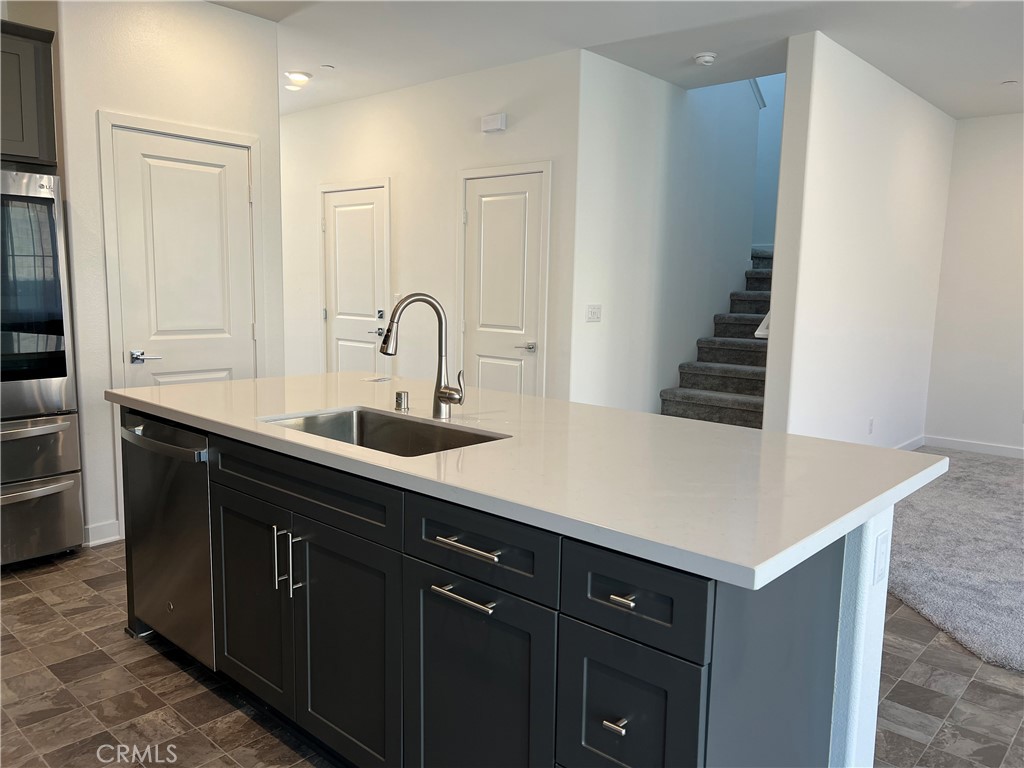 2595 Pheasant Way Ontario, CA 91761 - Photo 10 of 34 a kitchen with a sink and cabinets