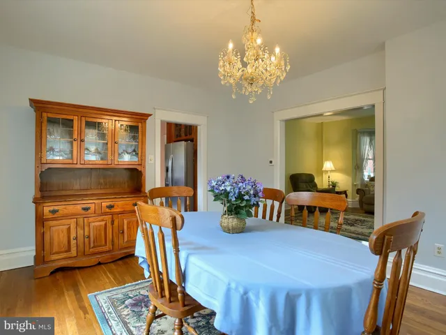 a kitchen with stainless steel appliances granite countertop a sink dishwasher stove and refrigerator