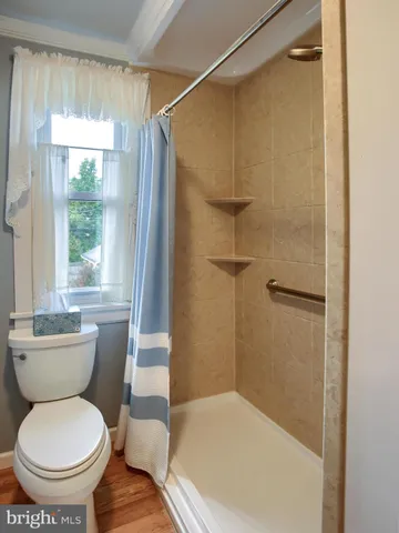 a view of empty room with wooden walls