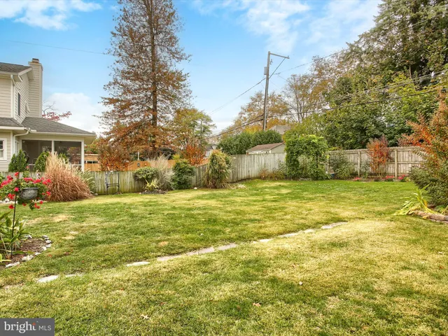 a view of a house with pool and sitting area