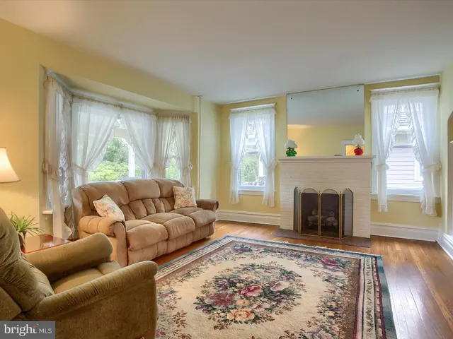 a living room with furniture and a rug